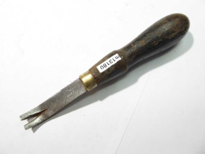 Leather tack puller, small crack in handle, makers mark
